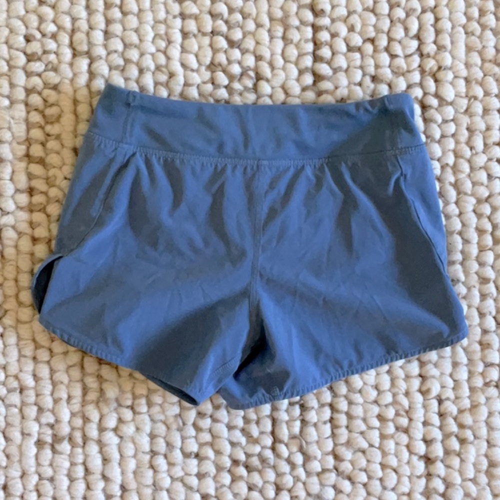 Cute Athleta girl shorts - gently worn. Zippered pocket in back.